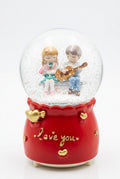 Romantic couple musical snow globe